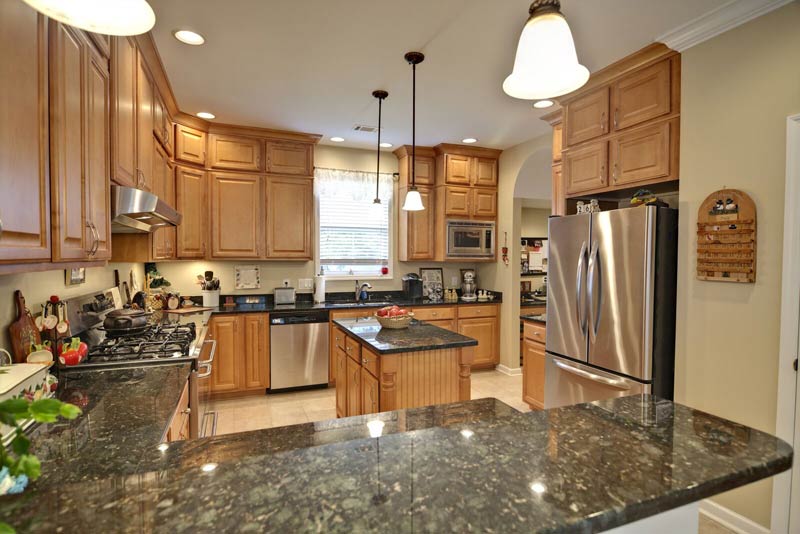 Granite Countertops green maple cabinets US Affordable Granite Company, US